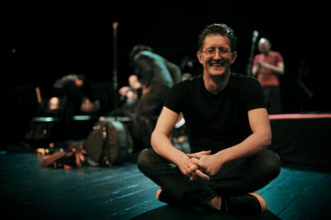 Executive Director of Austin Classical Guitar, Matt Hinsley on stage before a performance by Jaime Ibarra